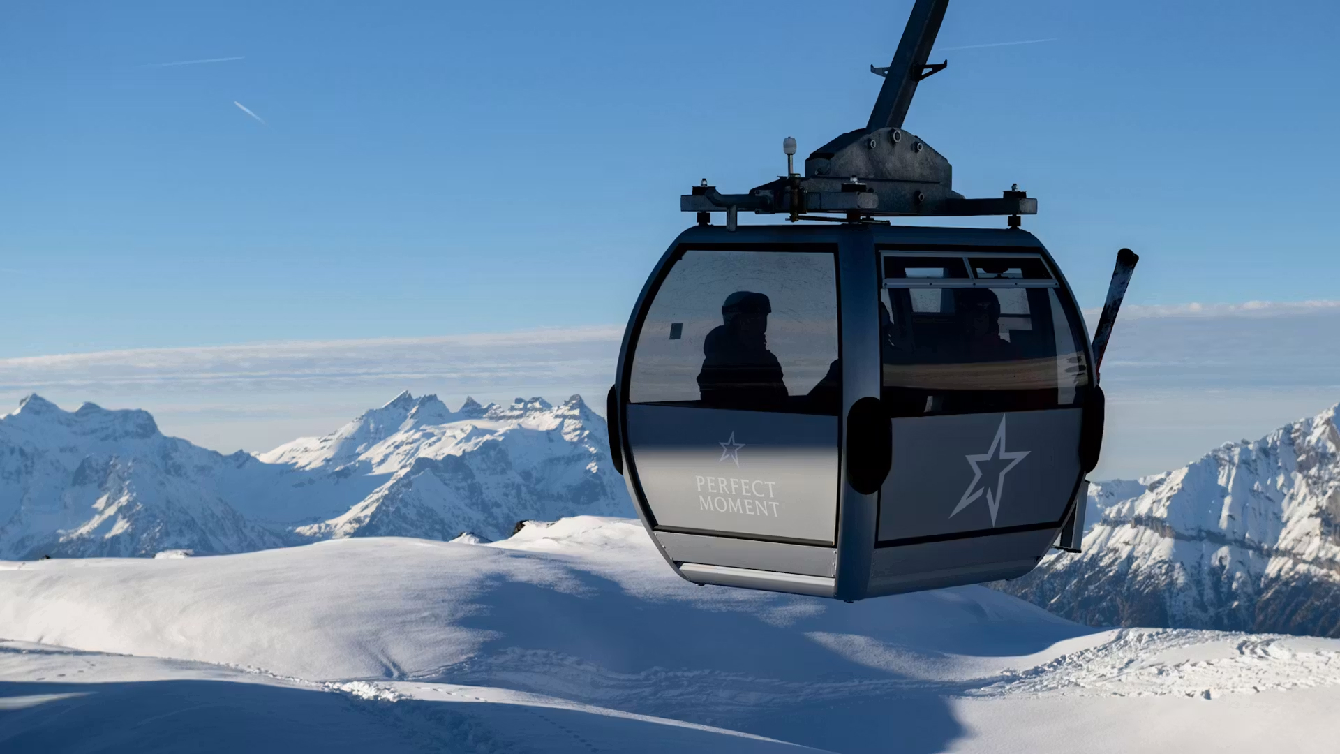 Cable car above the snow-covered mountains